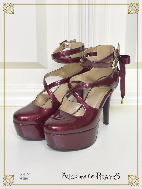 Spike Heel Enamel Cross Pumps by Alice and the Pirates